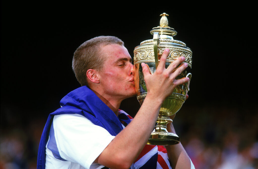 Lleyton Hewitt of Australia kisses the trophy after victory over David Nalbandian of Argentina in the Men's Singles Final of the Lawn Tennis Championships at the All England Club in Wimbledon, England on July 7, 2002. Hewitt won 6-1, 6-3, 6-2.