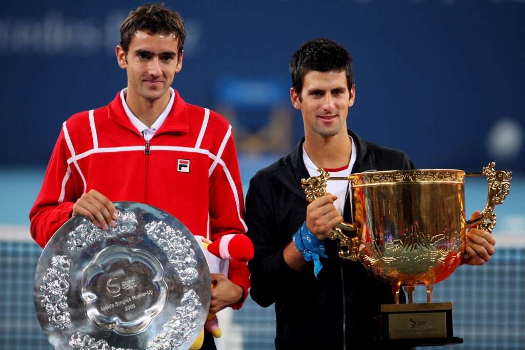 Winner Novak Djokovic of Serbia (R) and Marin Cilic of Croatia pose with their trophies after the men's final match during day ten of the 2009 China Open at the National Tennis Centre on October 11, 2009 in Beijing, China. Novak Djokovic of Serbia wins the tournament.