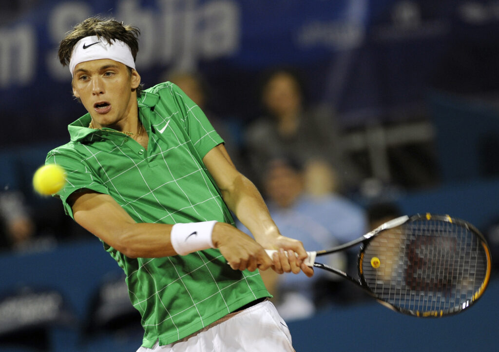 Filip Krajinovic of Serbia returns a bal