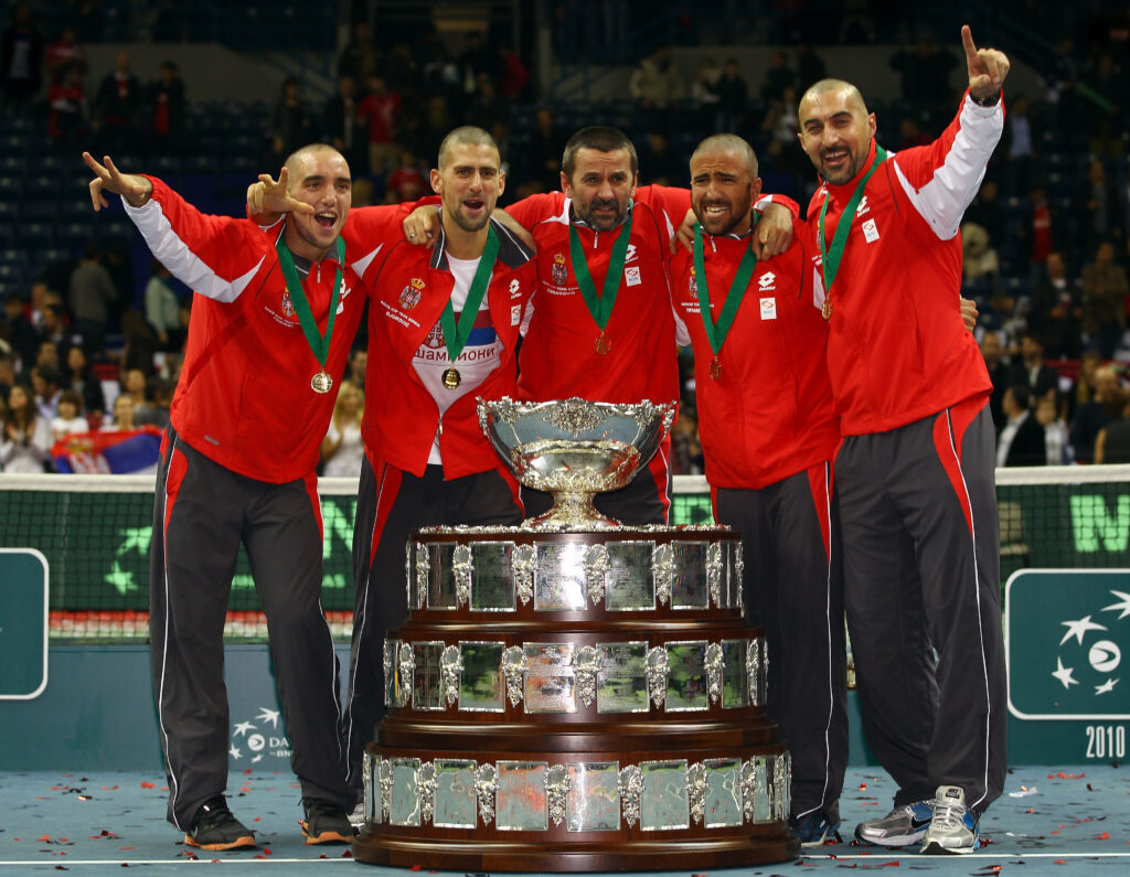 Bogdan Obradovic, Nenad Zimonjic, Novak Djokovic, Janko Tipsarevic and Viktor Troicki of Serbia celebrate with the trophy after defeating France during day three of the Davis Cup Tennis Final at the Begrade Arena on December 5, 2010 in Belgrade, Serbia.
