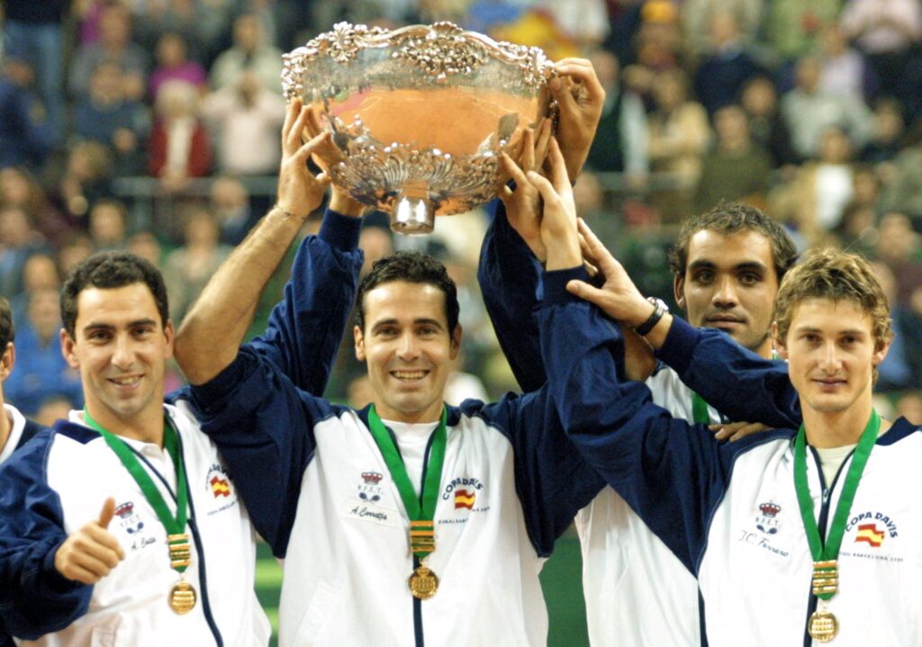 Spanish team hold the Davis cup after Juan Carlos Ferrero won the fourth match and the Davis cup final against Australian Lleyton Hewitt 10 december 2000 in Sant Jordi Palau in Barcelona.