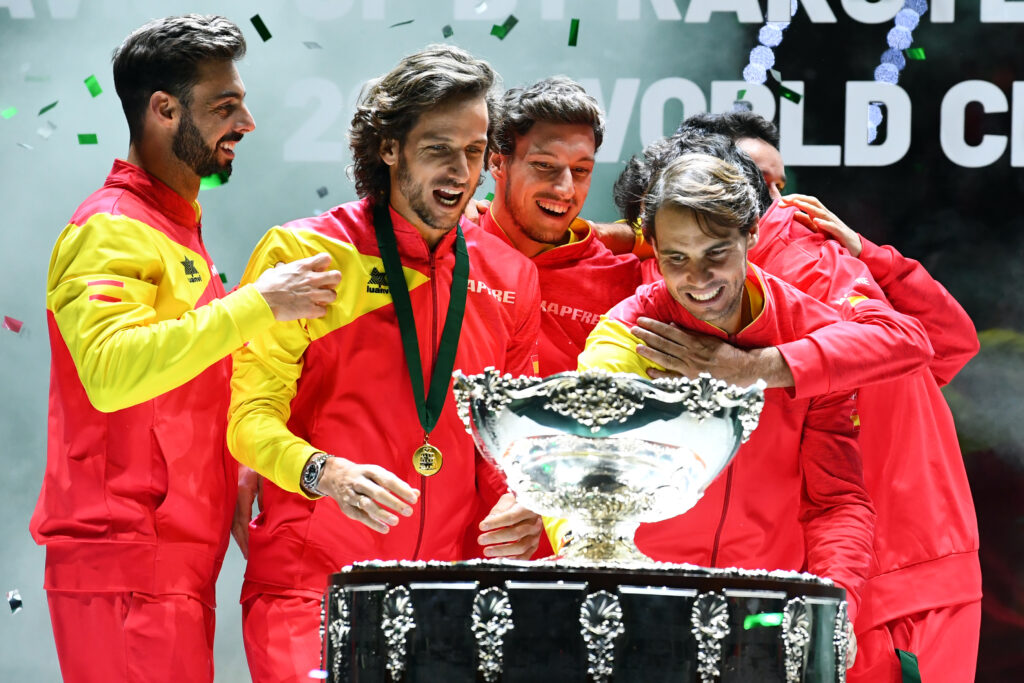 Spain's Rafael Nadal (R) and teammates pose with the winner's trophy during the trophy ceremony after winning the Davis Cup Madrid Finals 2019 in Madrid on November 24, 2019.