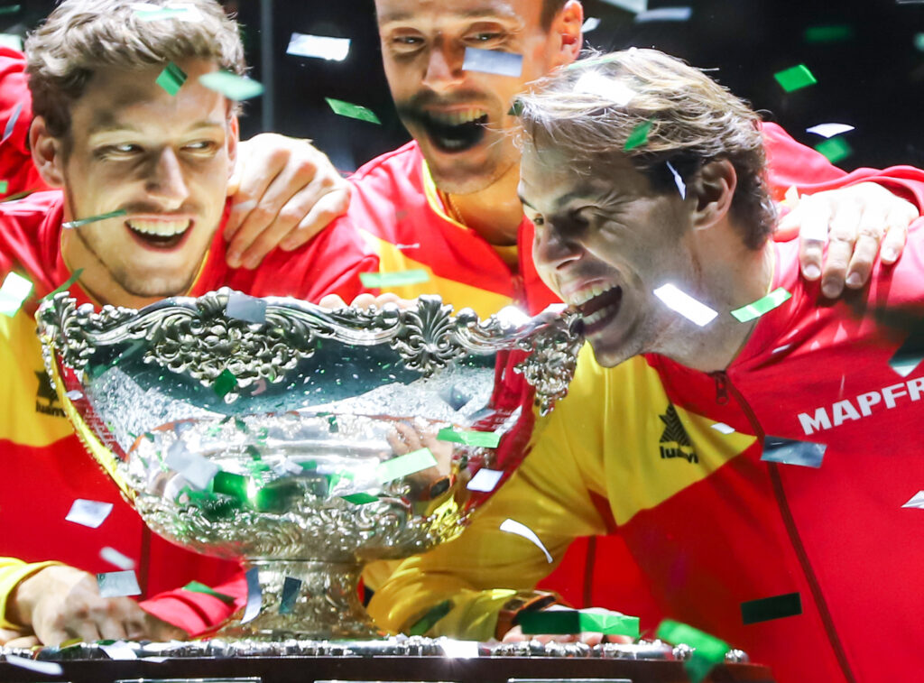 Spain's Rafael Nadal (2R) and teammates pose with the winner's trophy during the trophy ceremony after winning the Davis Cup Madrid Finals 2019 at Caja Magica on November 24, 2019 in Madrid.