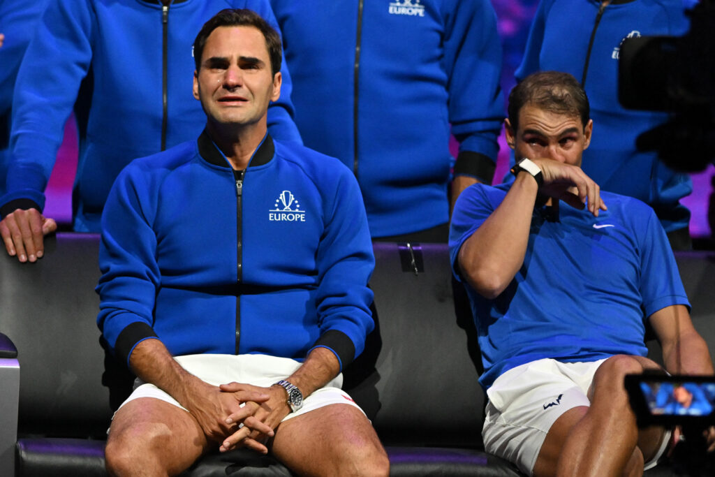 Switzerland's Roger Federer (L) sheds a tear after playing his final match, a doubles with Spain's Rafael Nadal (R) of Team Europe against USA's Jack Sock and USA's Frances Tiafoe of Team World in the 2022 Laver Cup at the O2 Arena in London, early on September 24, 2022