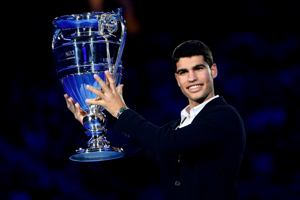 Carlos Alcaraz of Spain lifts the year-end ATP No. 1 trophy presented to him during day four of the Nitto ATP Finals in which Alcaraz does not participate due to an injury. Carlos Alcaraz becomes the youngest ATP player ever to end the year ranked number one.