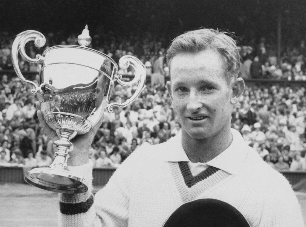 Rod Laver of Australia with the Gentlemen's Singles Trophy after defeating compatriot Martin Mulligan in the Men's Singles Final match at the Wimbledon Lawn Tennis Championship on 6th July 1962 at the All England Lawn Tennis and Croquet Club in Wimbledon in London, England. Rod Laver won the match 6 - 2, 6 - 2, 6 - 1.