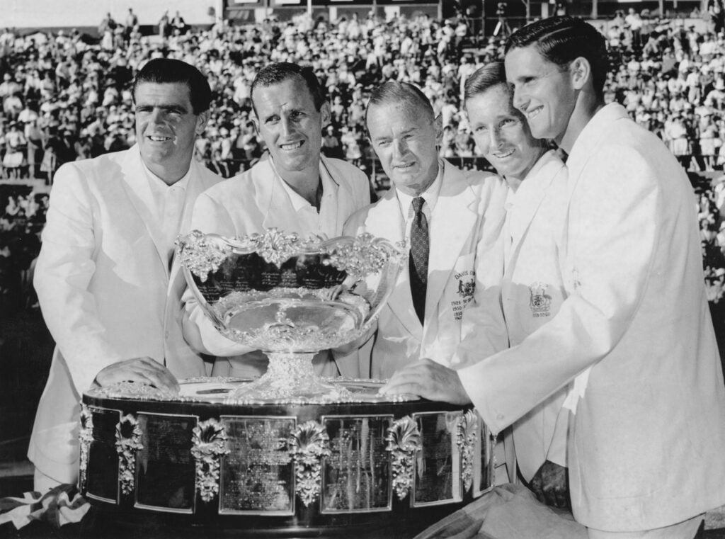 L - R, Bob Mark, Neale Fraser, team Captain Harry Hopman, Rod Laver and Roy Emerson of Australia celebrate with the winning Davis Cup trophy after defeating Italy in the Challenge Round for the 49th edition of the Davis Cup on 28th December 1960 at the White City Stadium, Sydney, Australia. Australia won the Davis Cup by 4 matches to 1.