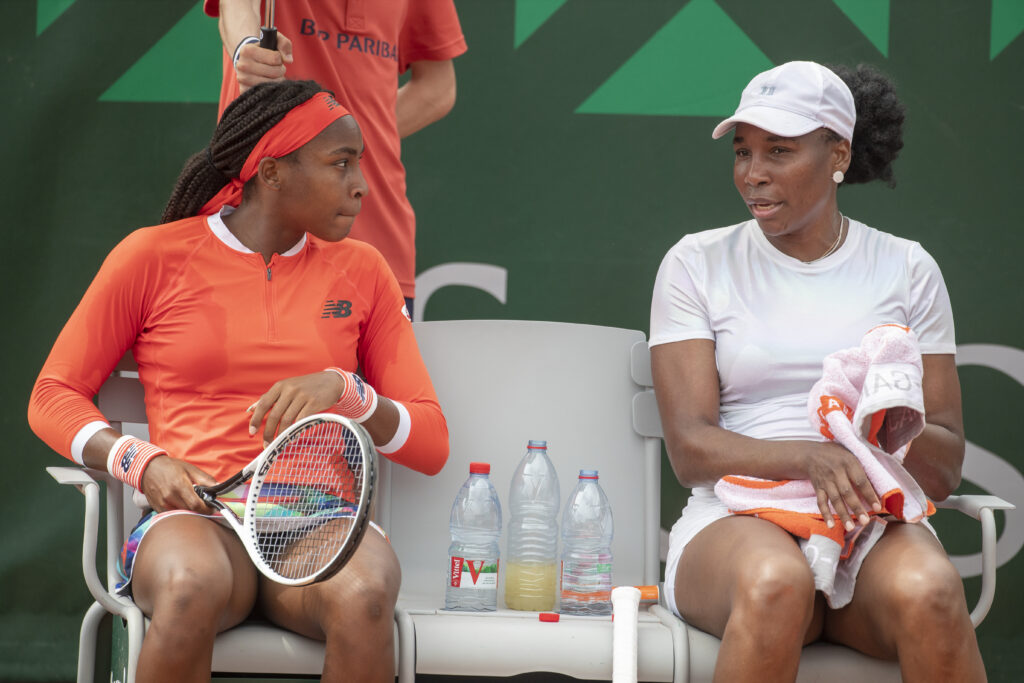 Venus Williams and Coco Gauff of the United States during their doubles match against Saisai Zheng of China and Ellen Perez of Australia on court nine during the second round of the singles competition at the 2021 French Open