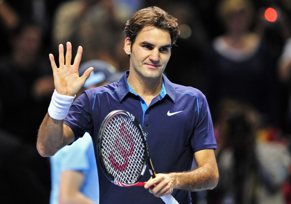Roger Federer of Switzerland waves to acknowledge the crowd after beating Rafael Nadal of Spain during their group B singles match in the round robin stage on day three at the ATP World Tour Finals.