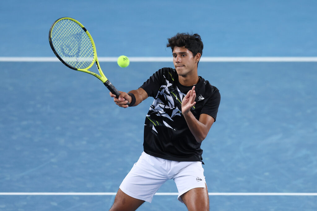Adolfo Daniel Vallejo pf Paraguay plays a forehand in his Junior Boys Doubles Final with Alex Michelsen of USA against Bruno Kuzuhara of USA and Chak Lam Coleman Wong of Hong Kong during day 12 of the 2022 Australian Open at Melbourne Park on January 28, 2022 in Melbourne, Australia.