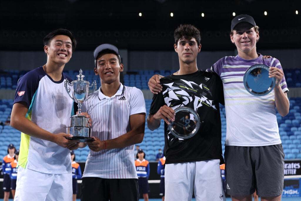 (L-R) Chak Lam Coleman Wong of Hong Kong, Bruno Kuzuhara of United States, Adolfo Daniel Vallejo of Paraguay and Alex Michelsen of United States pose during the trophy presentation of the Junior Boy’s Doubles Final during day 12 of the 2022 Australian Open at Melbourne Park on January 28, 2022 in Melbourne, Australia.