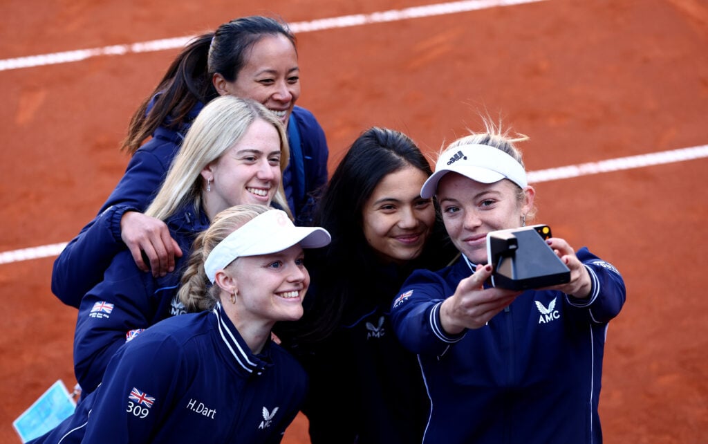 Harriet Dart, Sonay Kartal, Anne Keothavong, Emma Raducanu and Katie Swan of Great Britain take a team photograph after the deciding doubles match during day two of the Billie Jean King Cup Play-Off match between the Czech Republic and Great Britain at the Tennis Club 1. CLTK Prague on April 16, 2022 in Prague, Czech Republic.