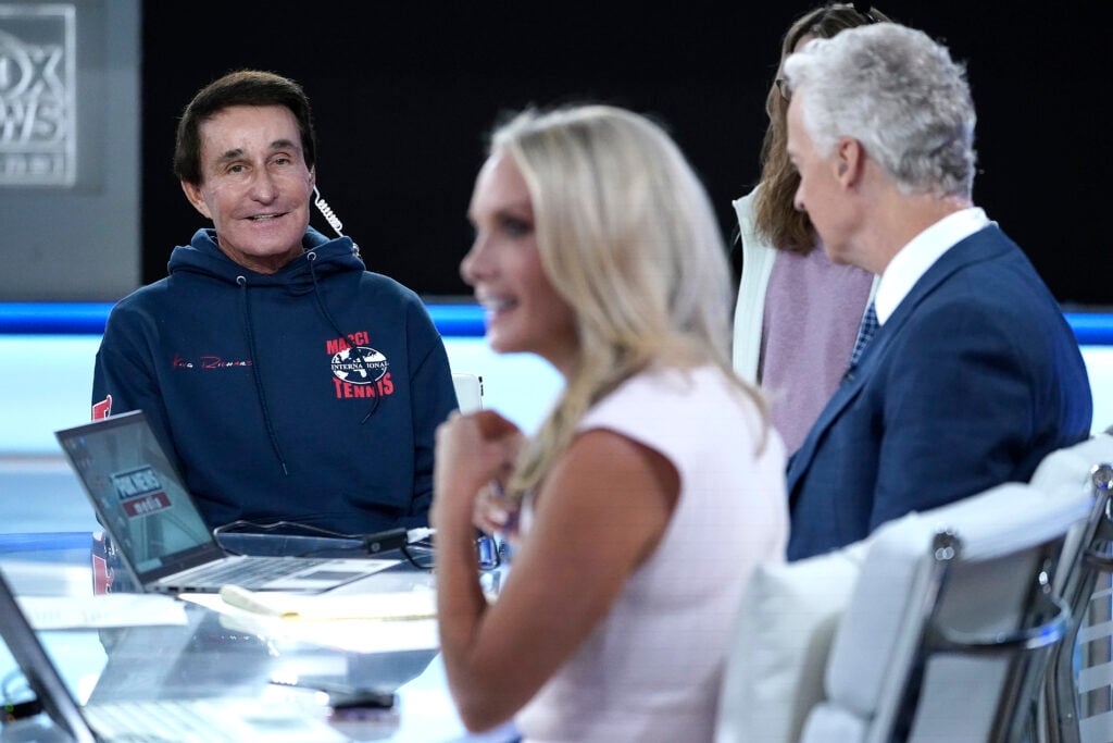 Professional tennis coach Rick Macci is interviewed by segment anchors Trace Gallagher and Dana Perino at Fox News' "America's Newsroom" at FOX Studios on August 29, 2022 in New York City.