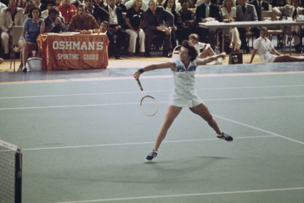 Tennis player Billie Jean King competing against retired pro Bobby Riggs in the 'Battle of the Sexes' match at the Houston Astrodome in Texas on September 20th, 1973. King won in three straight sets.