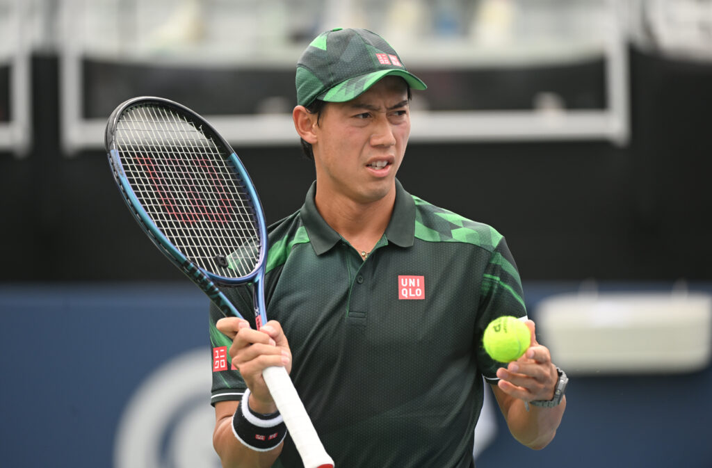 Kei Nishikori of Japan looks on in between serves against Taylor Fritz during the ATP Atlanta Open quarter finals at Atlantic Station on July 28, 2023 in Atlanta, Georgia.
