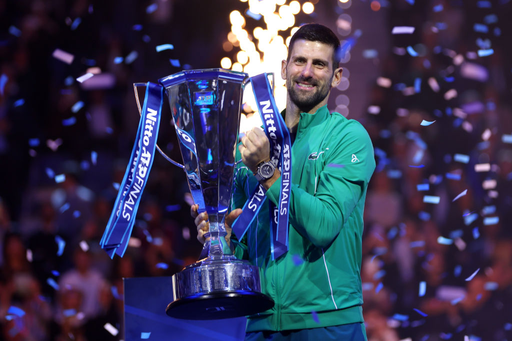 Novak Djokovic of Serbia celebrates with the Nitto ATP Finals trophy after victory against Jannik Sinner of Italy in the Men's Singles Finals between Jannik Sinner of Italy and Novak Djokovic of Serbia on day eight of the Nitto ATP Finals.