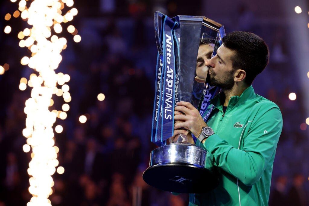 Novak Djokovic of Serbia kisses the Nitto ATP Finals trophy after victory against Jannik Sinner of Italy in the Men's Singles Finals between Jannik Sinner of Italy and Novak Djokovic of Serbia on day eight of the Nitto ATP Finals at Pala Alpitour on November 19, 2023 in Turin, Italy.