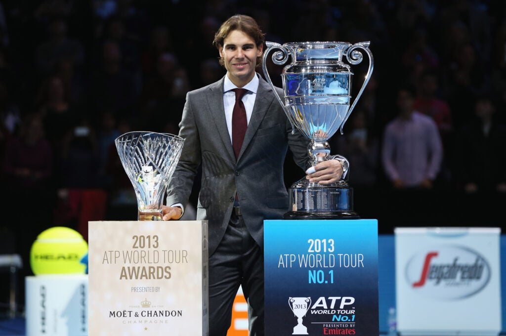 Rafael Nadal of Spain poses with the ATP World Tour No. 1 award and the Comeback Player of the Year award during day six of the Barclays ATP World Tour Finals