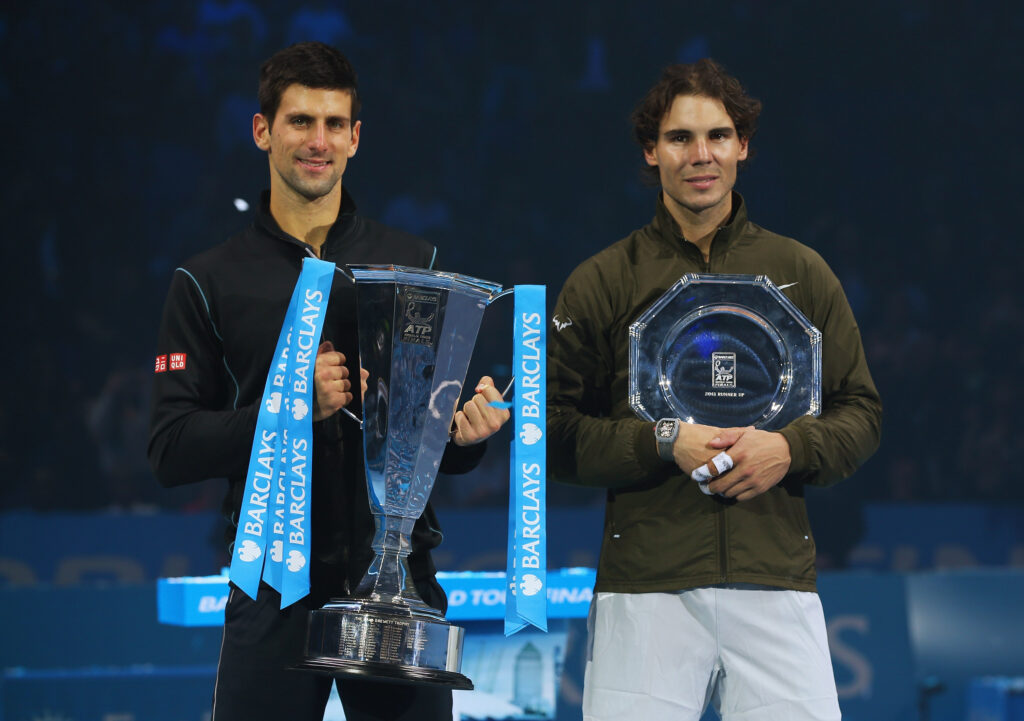 Champion Novak Djokovic (L) of Serbia and Rafael Nadal of Spain pose with their trophies after their men's singles final match during day eight of the Barclays ATP World Tour Finals at O2 Arena on November 11, 2013 in London.