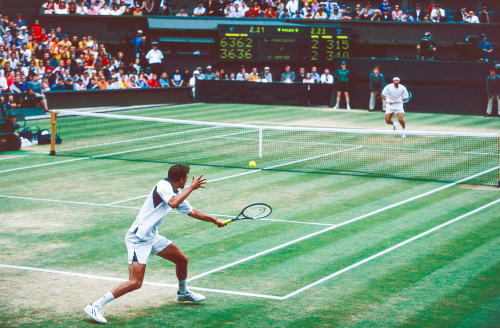 A wide angle of Goran Ivanisevic and Pat Rafter playing on Wimbledon's Centre Court