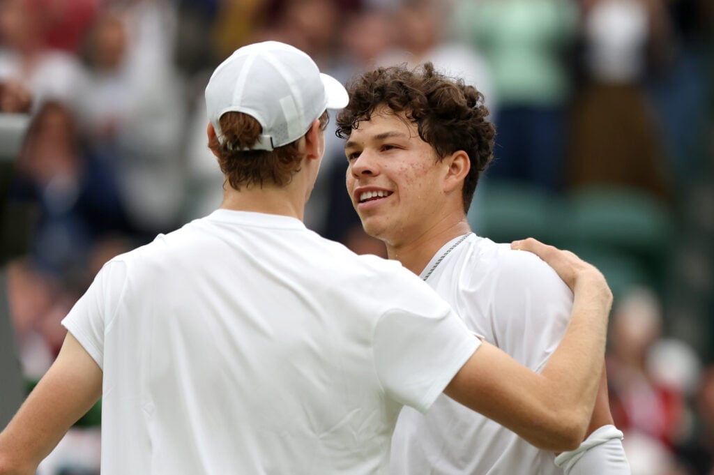 Jannik Sinner of Italy meets Ben Shelton of United States (R) at the net following his victory in his Gentleman's Singles fourth round match during day seven of The Championships Wimbledon 2024 at All England Lawn Tennis and Croquet Club on July 07, 2024 in London, England.