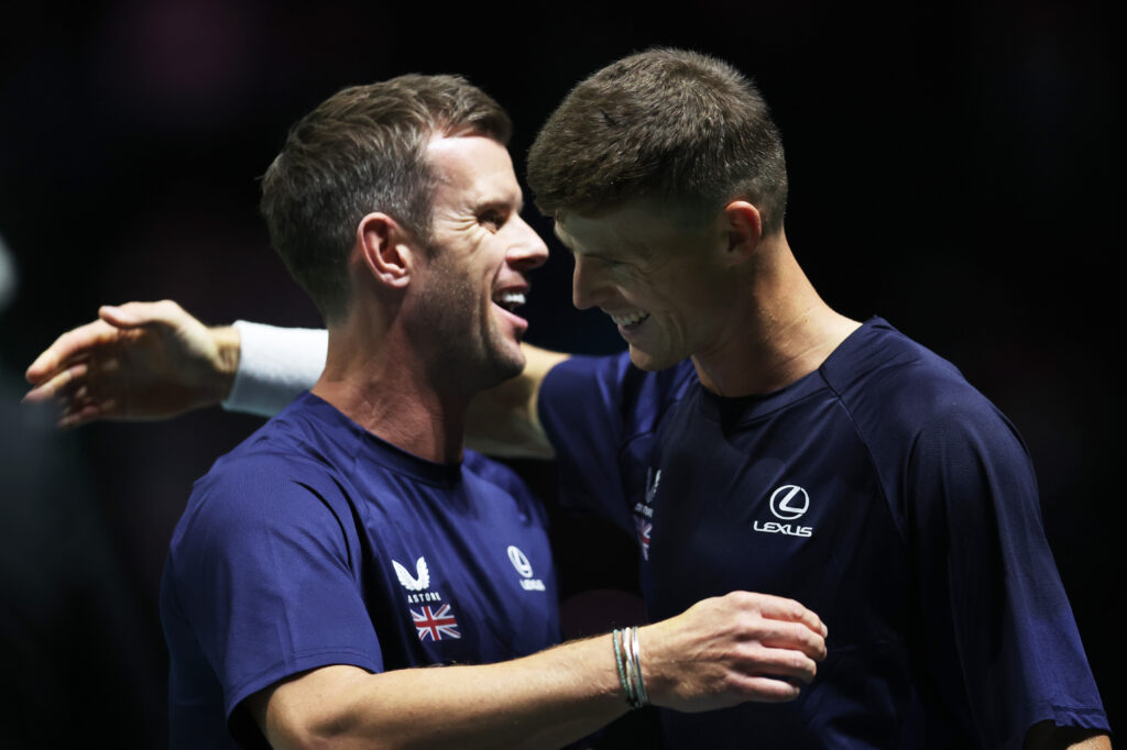 Billy Harris of Great Britain celebrates victory against Otto Virtanen of Finland in their singles match with Leon Smith, Captain of Great Britain, during the Group Stage tie between Finland and Great Britain in the Davis Cup Finals at AO Arena on September 11, 2024 in Manchester, England.