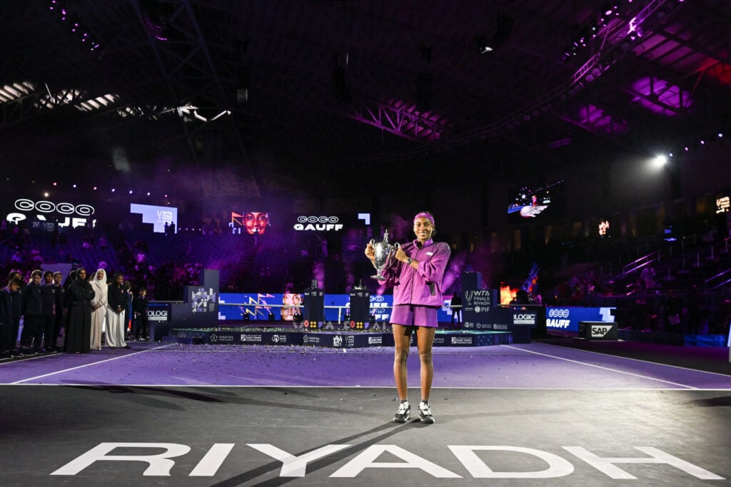 Coco Gauff poses with WTA Finals trophy