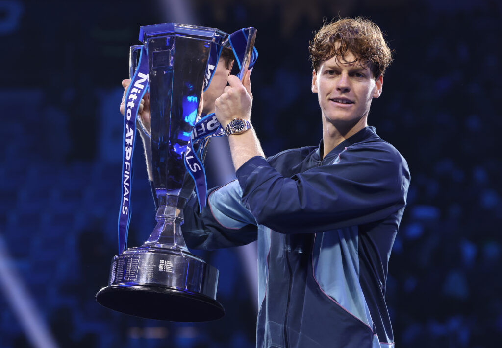 Jannik Sinner of Italy celebrates with the trophy after his victory against Taylor Fritz of United States during the Men's Singles final match on day eight of the Nitto ATP finals 2024 at Inalpi Arena on November 17, 2024 in Turin, Italy.