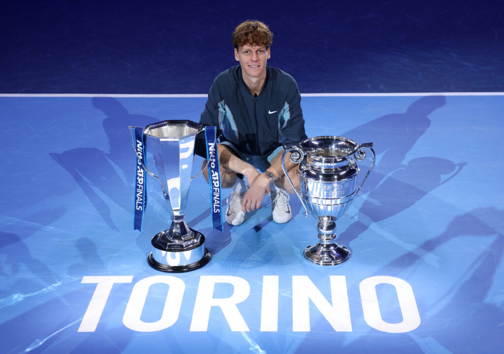 Jannik Sinner of Italy poses for a photo with the Nitto ATP Finals trophy and ATP World Number One Player trophy after his victory against Taylor Fritz of United States after the Men's Singles final match on day eight of the Nitto ATP finals