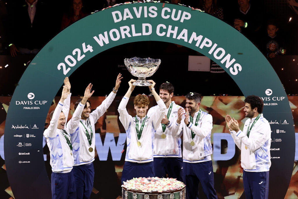 Filippo Volandri, Jannik Sinner, Lorenzo Musetti, Matteo Berrettini, Andrea Vavassori and Simone Bolelli of Italy lift the Davis Cup Trophy after their teams victory during the Davis Cup Final match against Netherlands during the Davis Cup Finals at Palacio de Deportes Jose Maria Martin Carpena on November 24, 2024 in Malaga, Spain.
