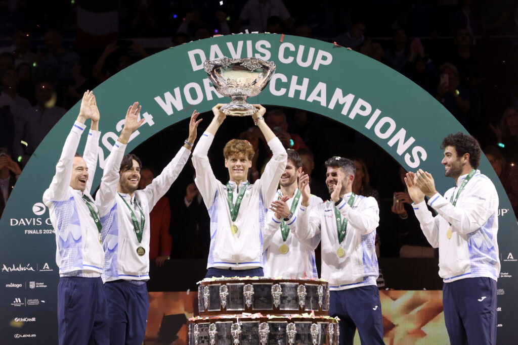 Filippo Volandri, Jannik Sinner, Lorenzo Musetti, Matteo Berrettini, Andrea Vavassori and Simone Bolelli of Italy lift the Davis Cup Trophy after their teams victory during the Davis Cup Final match against Netherlands during the Davis Cup Finals at Palacio de Deportes Jose Maria Martin Carpena on November 24, 2024 in Malaga, Spain.