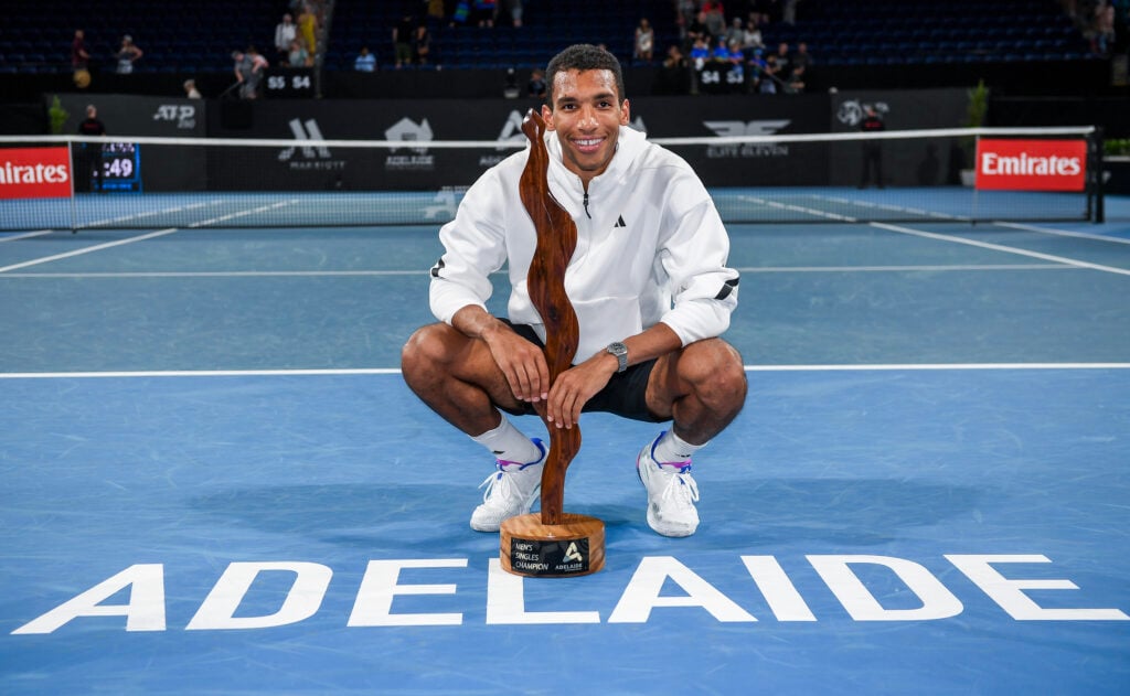 Felix Auger-Aliassime of Canada poses with the Mens Singles Champion Trophy during day six of the 2025 Adelaide International at Memorial Drive on January 11, 2025.