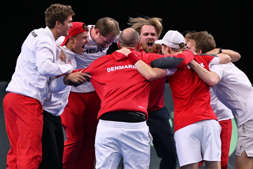 Elmer Moller of Denmark celebrate victory after defeating in his single match against Hamad Medjedovic of Serbia with his teammates during day 2 of the Davis Cup Qualifier first round match between Denmark and Serbia.