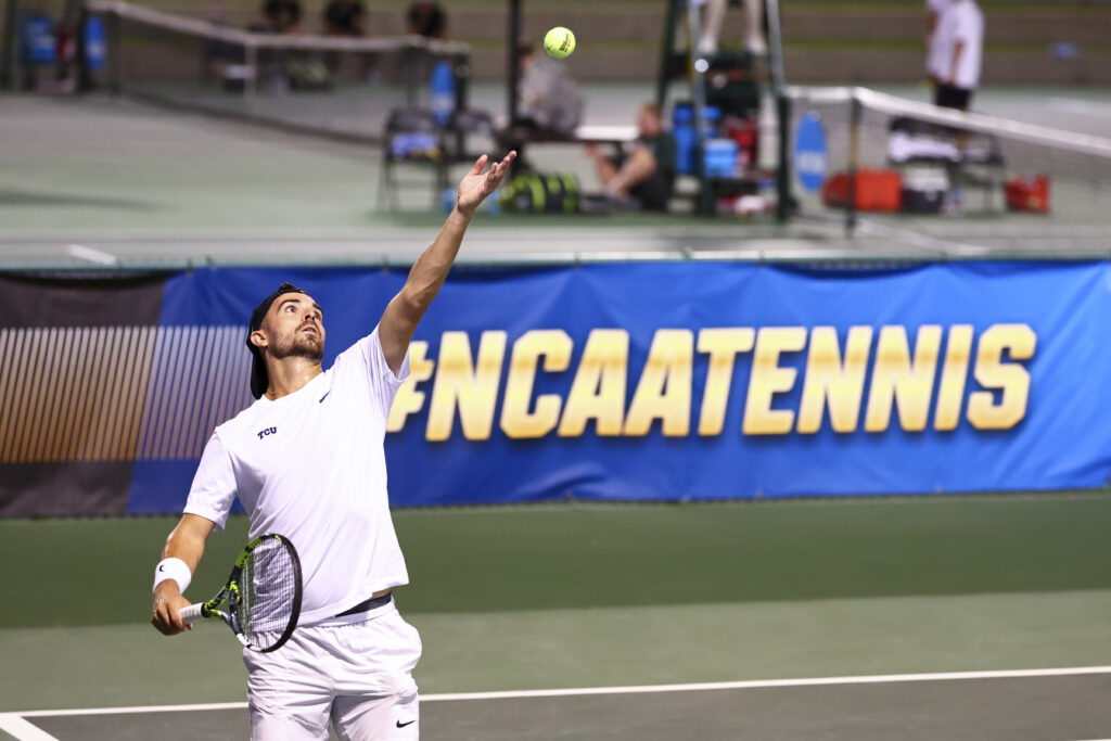 Pedro Vives of the TCU Horned Frogs serves against DK Suresh Ekambaram of the Wake Forest Demon Deacons during the NCAA Division I Men's Tennis Championship held at the Hurd Tennis Center on May 18, 2025 in Waco, Texas.