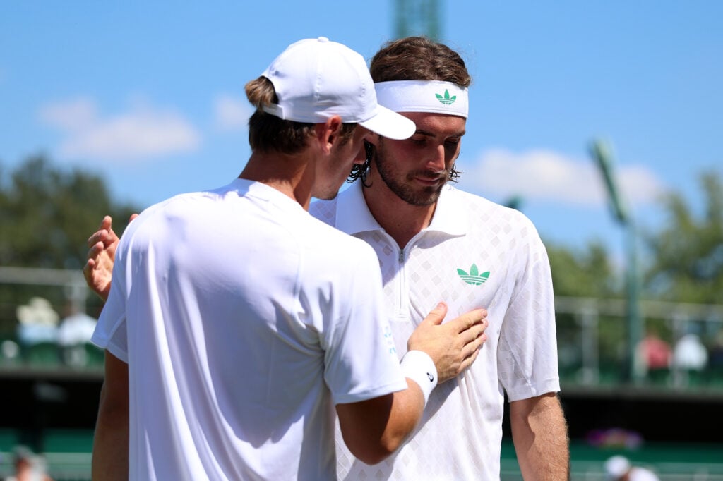 Stefanos Tsitsipas of Greece retires against Valentin Royer of France during the Gentlemen's Singles first round match on day one of The Championships Wimbledon 2025