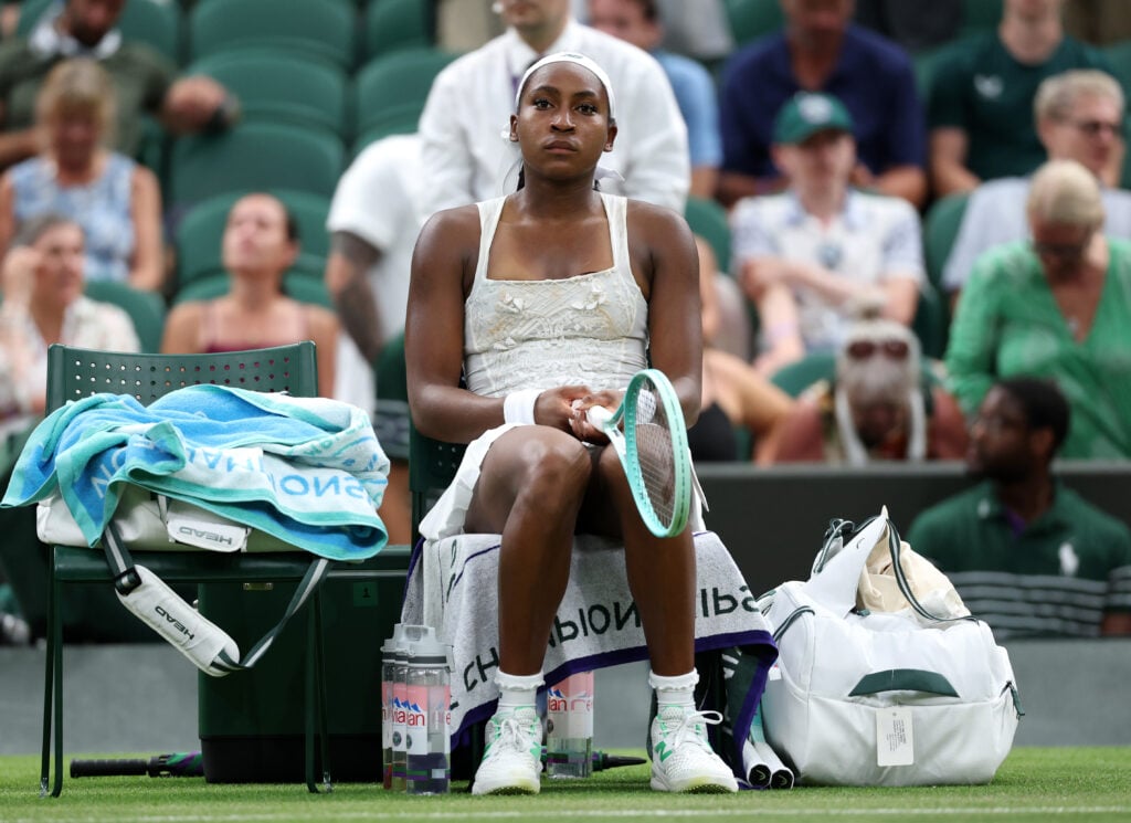 Coco Gauff, sat on her bench during a changeover, looks dejected
