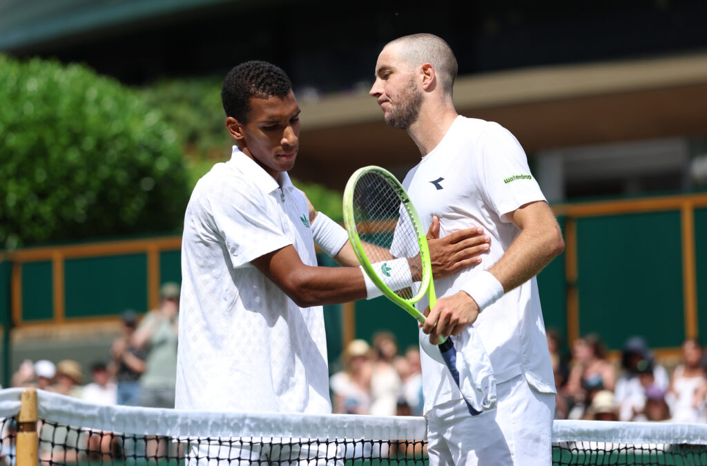 Felix Auger-Aliassime of Canada greets Jan-Lennard Struff of Germany at the net following defeat during the Gentlemen's Singles second round match on day four of The Championships Wimbledon 2025 at All England Lawn Tennis and Croquet Club on July 03, 2025 in London, England.