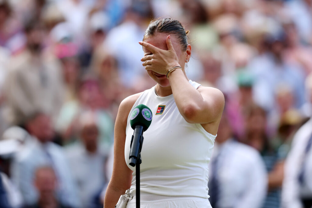 Amanda Anisimova of United States looks dejected as she speaks in the post match interview with the Ladies’ Singles Runner-Up Trophy, following defeat against Iga Swiatek of Poland during the Ladies' Singles Final on day thirteen of The Championships Wimbledon 2025.