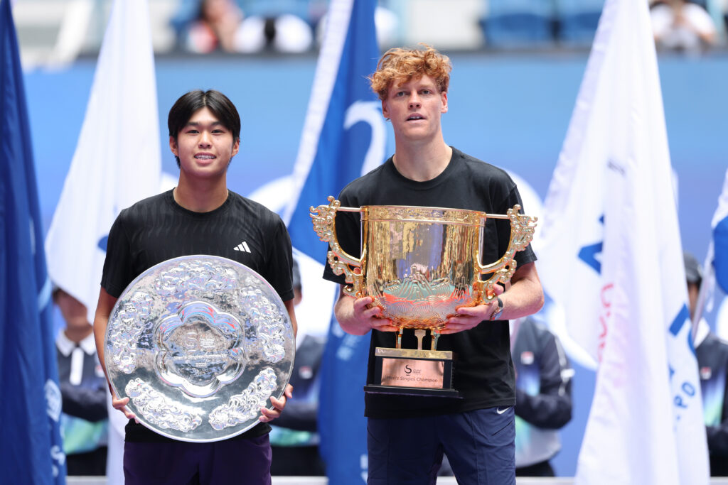 Learner Tien of the United States and Jannik Sinner of Italy pose with their trophies during medal ceremony after the Men's Singles final match on day 10 of 2025 China Open at National Tennis Center on October 01, 2025 in Beijing, China.