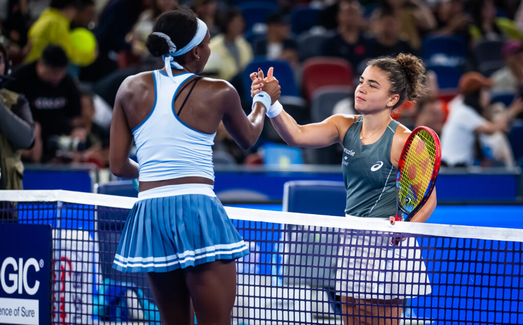 Coco Gauff of the United States and Jasmine Paolini of Italy shake hands at the net after the semi-final on Day 8 of the Wuhan Open