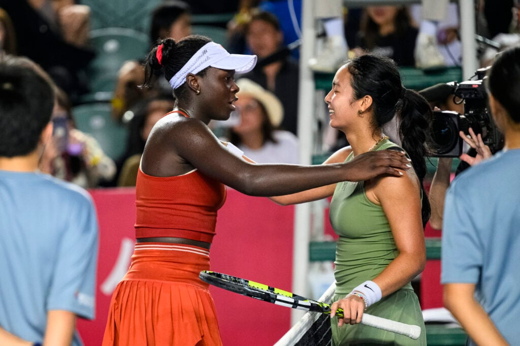 Match winner Victoria Mboko of Canada (L) high five Alexandra Eala of Philippines (R) during the women's singles round of 16 matches on day four of the Prudential Hong Kong Tennis Open at Victoria Park on October 30, 2025 in Hong Kong, China.