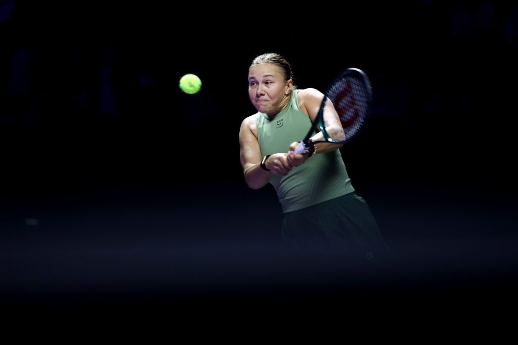 Amanda Anisimova of United States plays a backhand against Elena Rybakina of Kazakhstan during their Round Robin Singles match on day one of the WTA Finals Riyadh as part of the Hologic WTA Tour 2025 at King Saud University Indoor Arena on November 01, 2025 in Riyadh, Saudi Arabia.