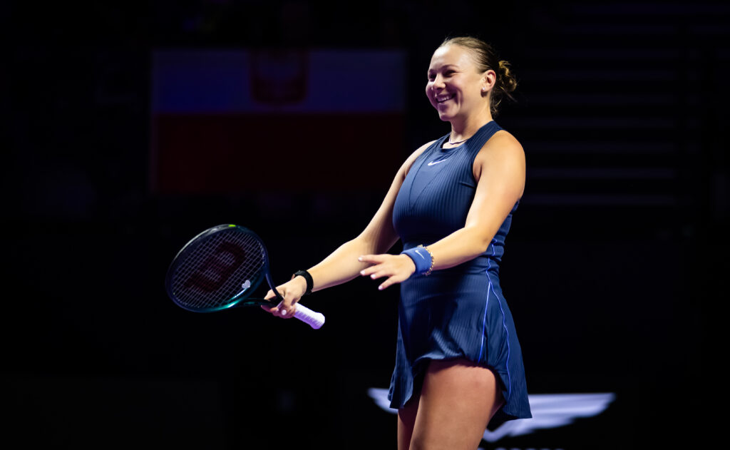 Amanda Anisimova of the United States in action against Iga Swiatek of Poland in the third round robin singles match on Day 5 of the WTA Finals.