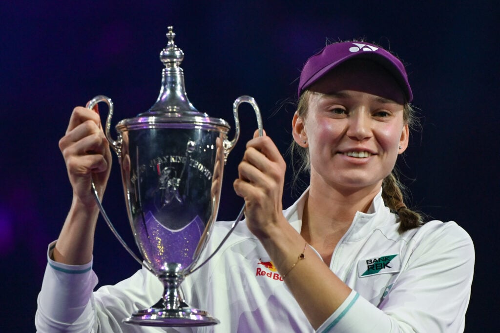 Elena Rybakina of Kazakhstan celebrates with the Billie Jean King Trophy after defeating Aryna Sabalenka in the singles final on Day 8 of the 2025 WTA Finals.