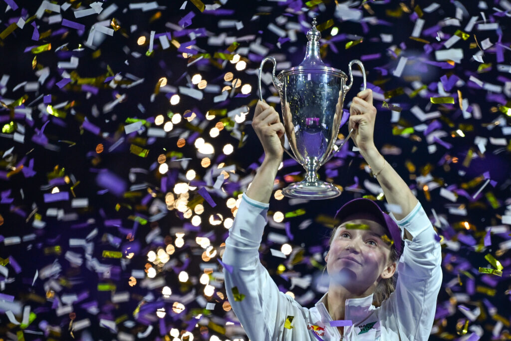 Elena Rybakina of Kazakhstan celebrates with the Billie Jean King Trophy after defeating Aryna Sabalenka in the singles final on Day 8 of the 2025 WTA Finals.