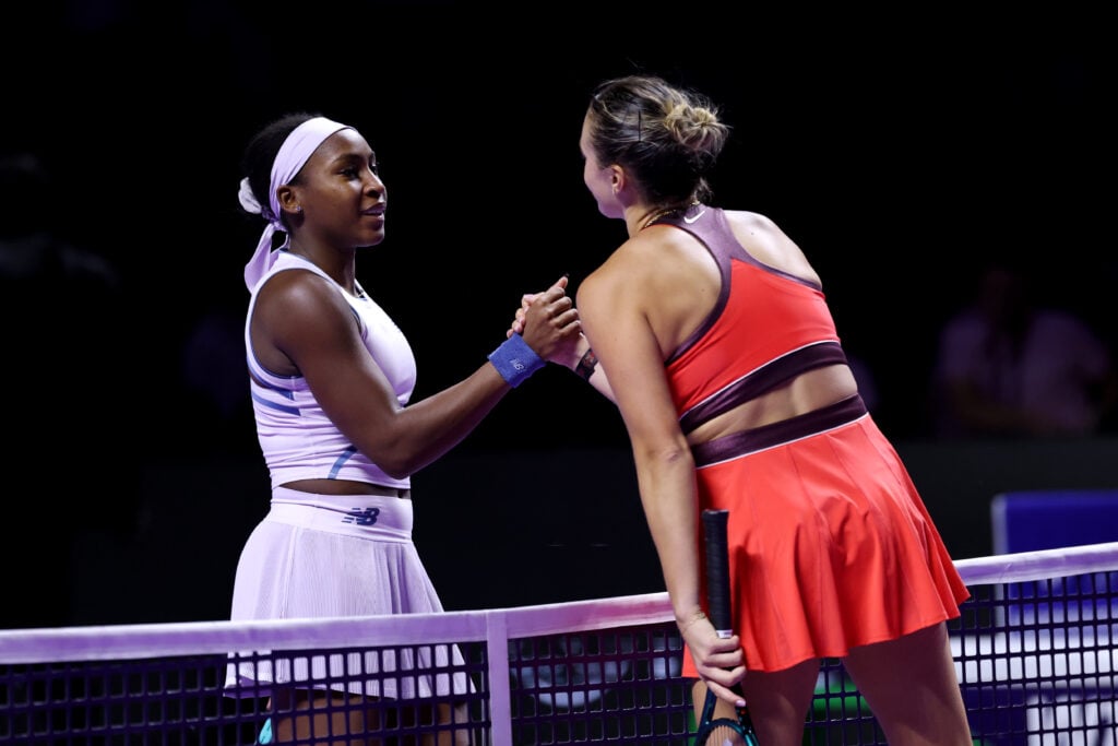 Coco Gauff and Aryna Sabalenka shake hands at the net