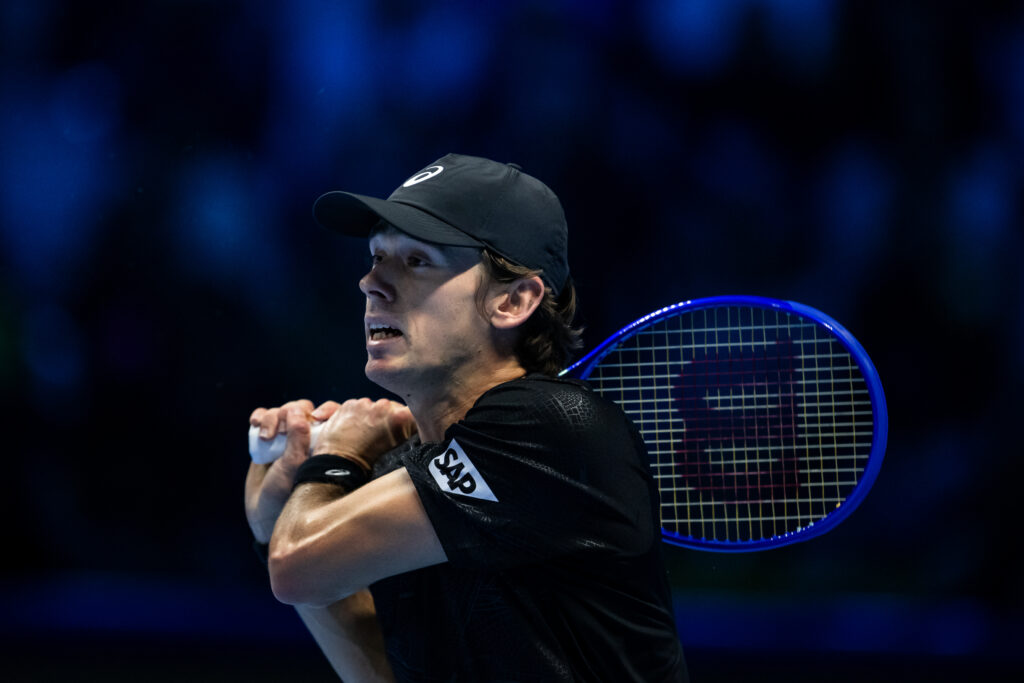 Alex de Minaur of Australia in action against Carlos Alcaraz of Spain during the Group Stage match on day one of the Nitto ATP Finals.