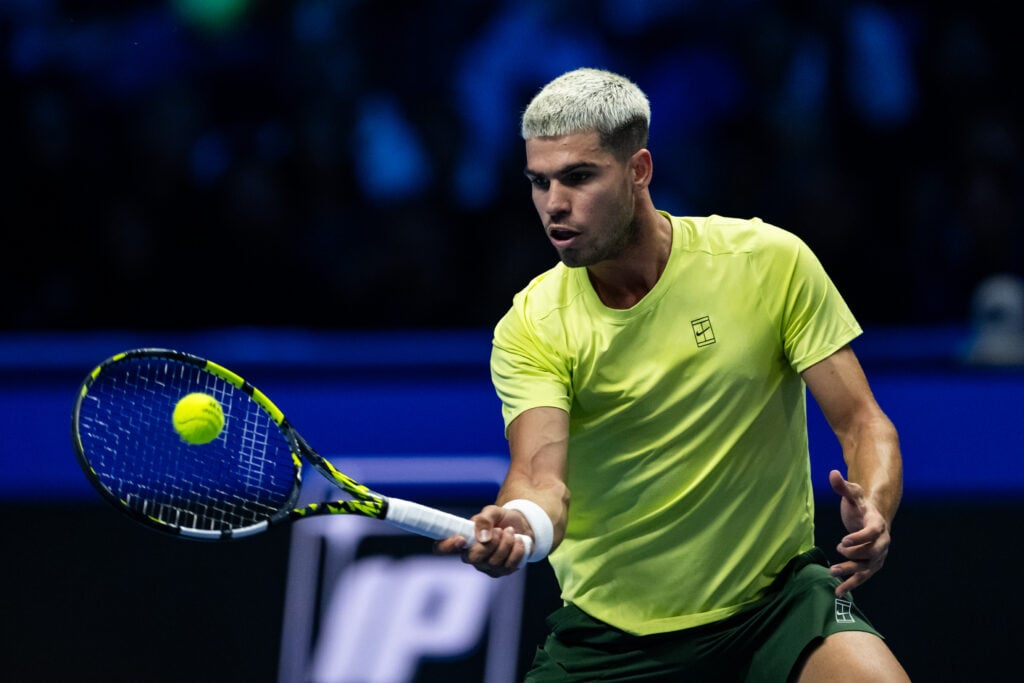 Carlos Alcaraz of Spain in action against Alex de Minaur of Australia during the Group Stage match on day one of the Nitto ATP Finals 2025 at Inalpi Arena on November 09, 2025 in Turin, Italy.