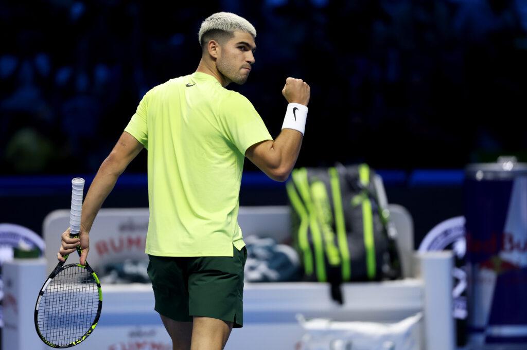 Carlos Alcaraz of Spain celebrates a point against Alex de Minaur of Australia during the Group Stage match on day one of the Nitto ATP Finals 2025 at Inalpi Arena on November 09, 2025.