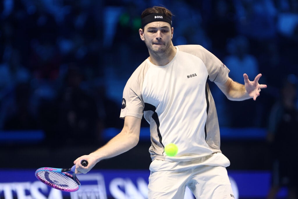 Taylor Fritz of USA controls the ball during the singles match between Taylor Fritz of Usa and Alex De Minaur of Australia during day five of the Nitto ATP Finals 2025 at Inalpi Arena on November 13, 2025 in Turin, Italy.